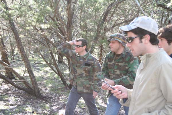 Throwing knife contest on an old cedar tree